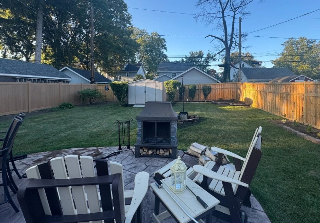 Evenly cut backyard lawn in West Irondequoit, NY