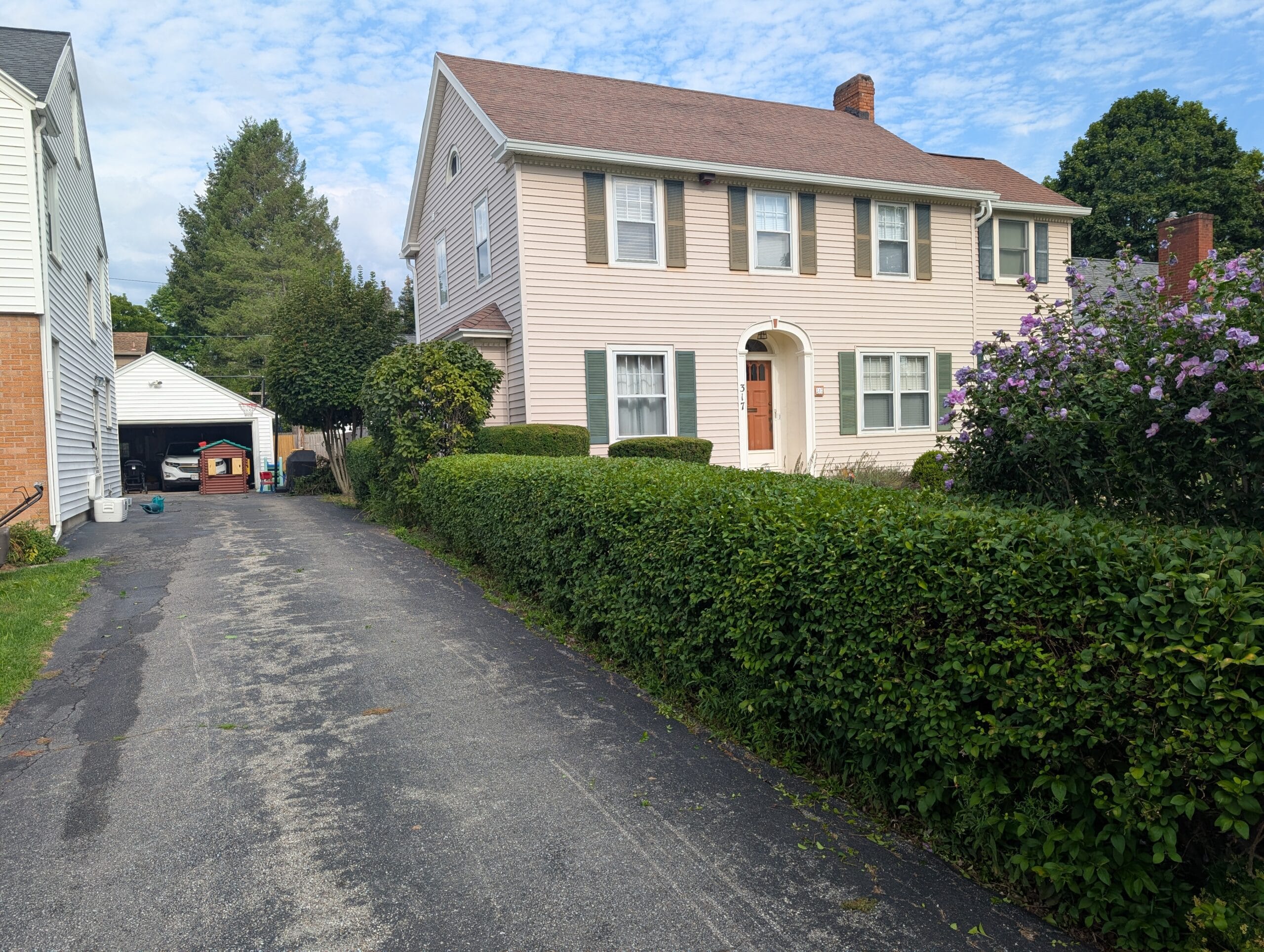 Finished bush trimming creating a neat landscape in Brighton NY