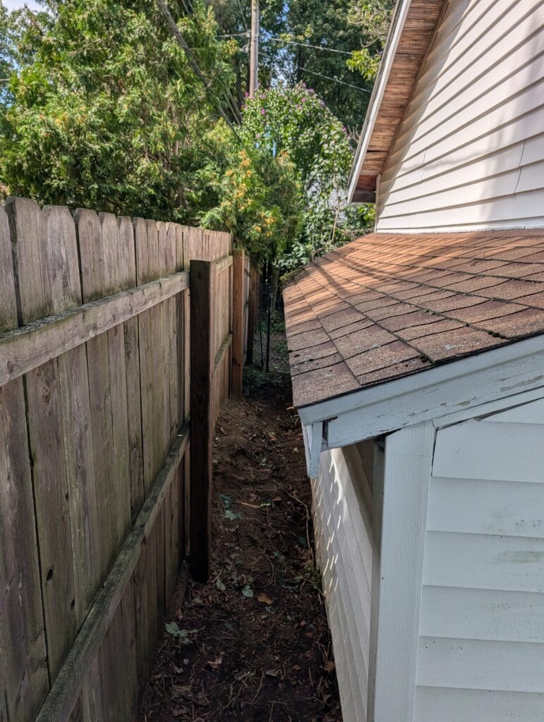 Area behind garage cleared after yard cleanup in Irondequoit NY