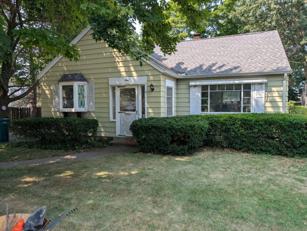 Completed bush trimming with clean, shaped shrubs in Irondequoit NY