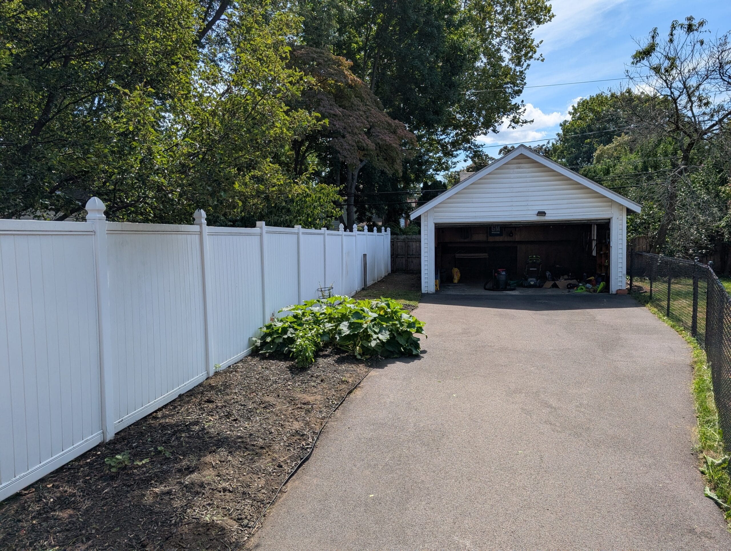 Yard and garage cleared after junk removal and cleanup in Irondequoit NY
