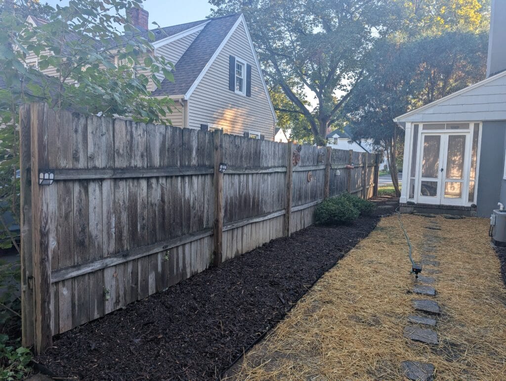 Garden after cleanup, edging, and mulch installation in Brighton NY