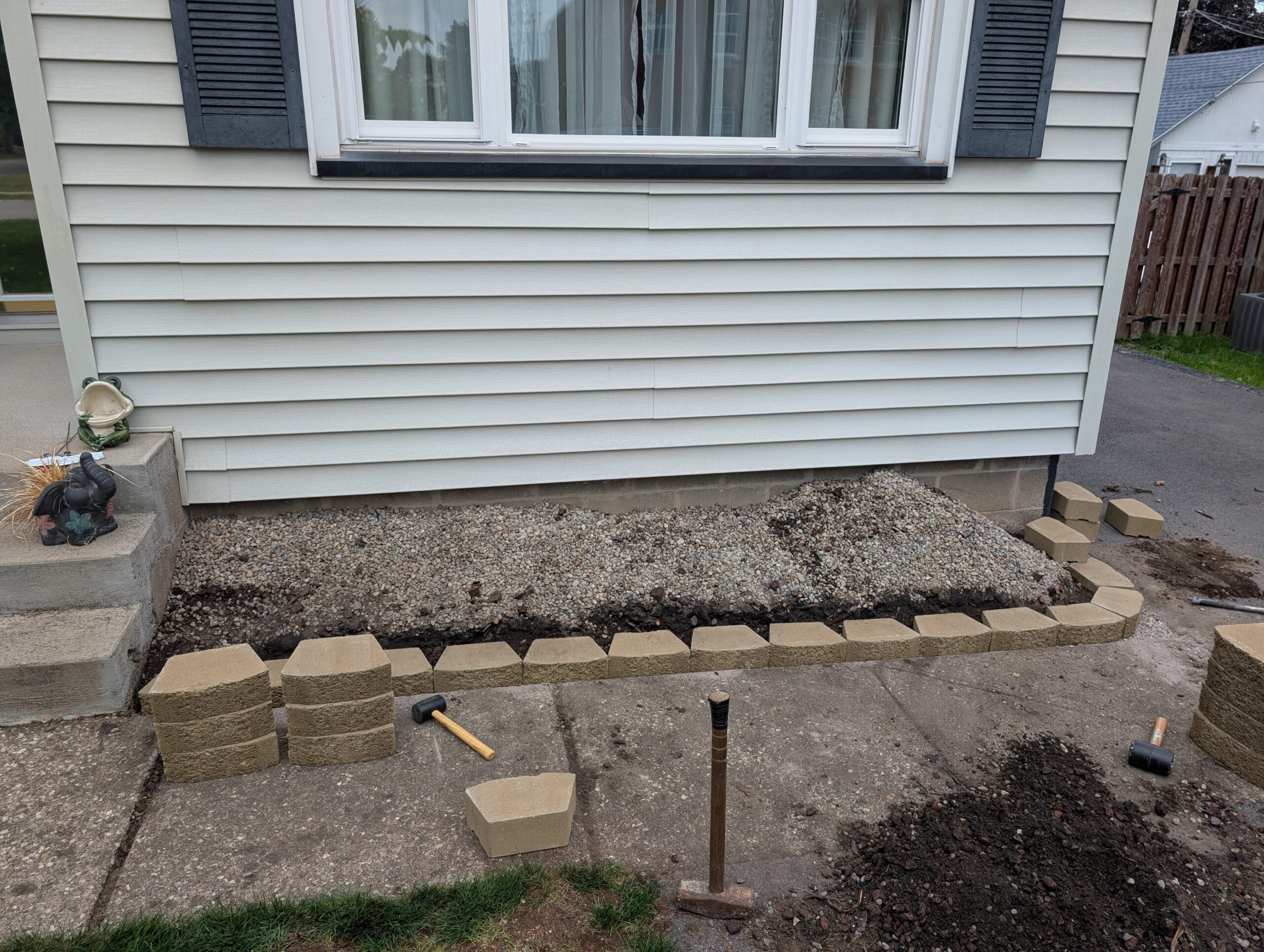 Paver base being leveled for new garden edging in Irondequoit NY
