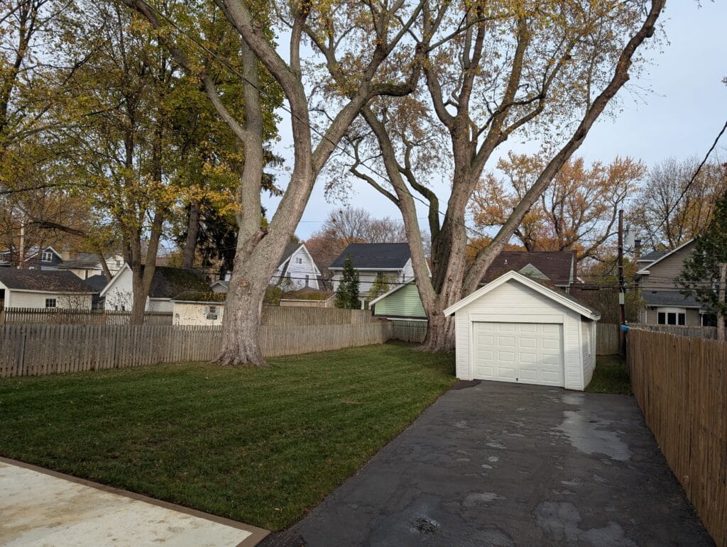Backyard after leaf removal and lawn mowing in Irondequoit NY