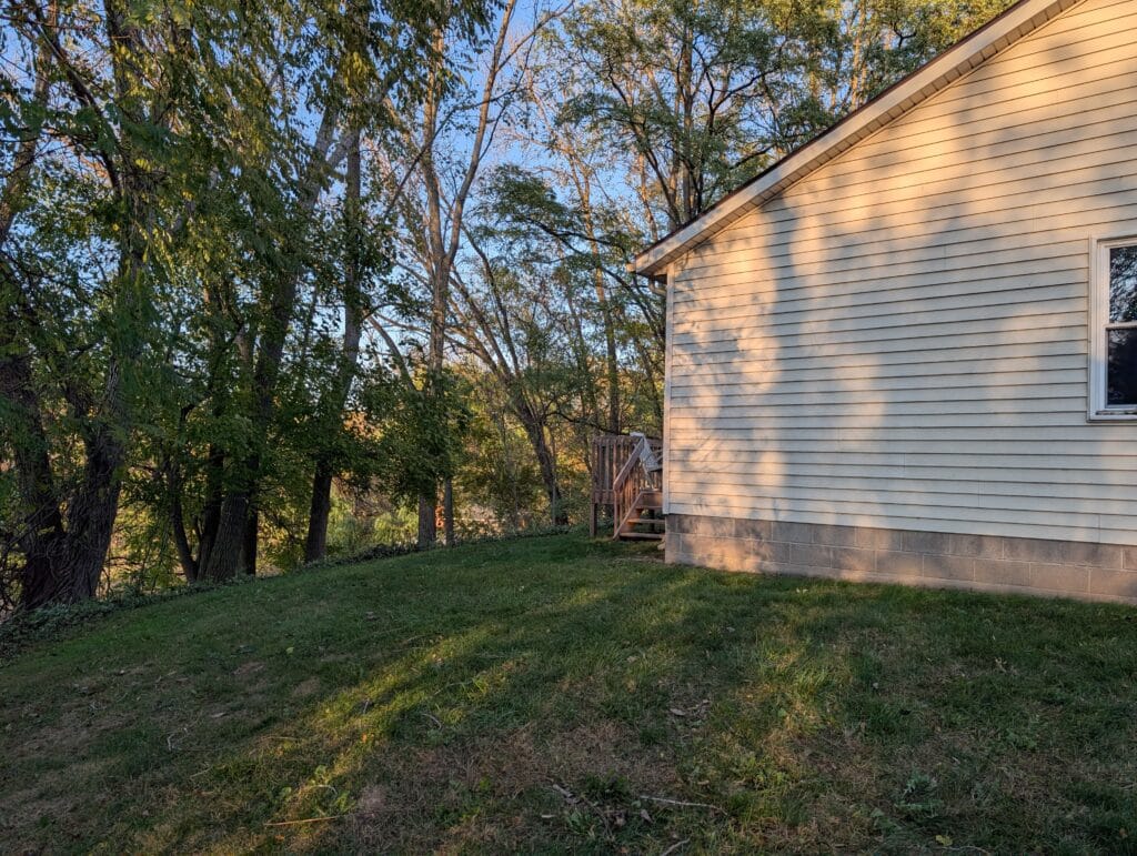 Side yard after leaf blowing and removal in Irondequoit NY