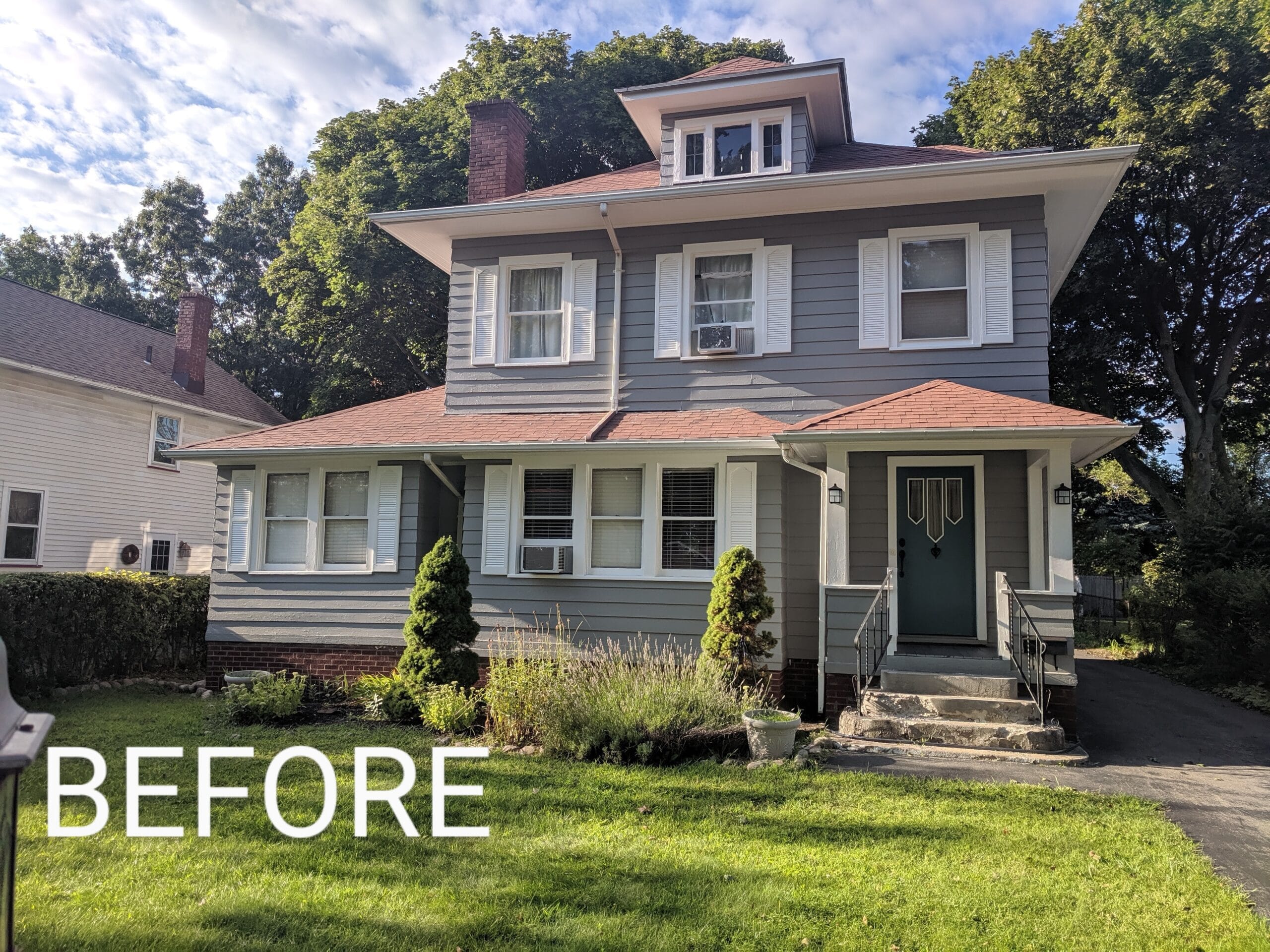 Overgrown garden bed before mulching in Irondequoit NY