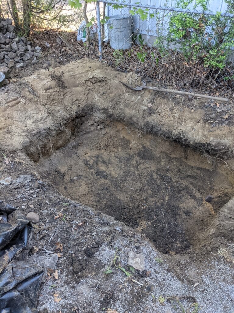 Old pond partially filled in Irondequoit as part of preparing the ground for a paver patio.