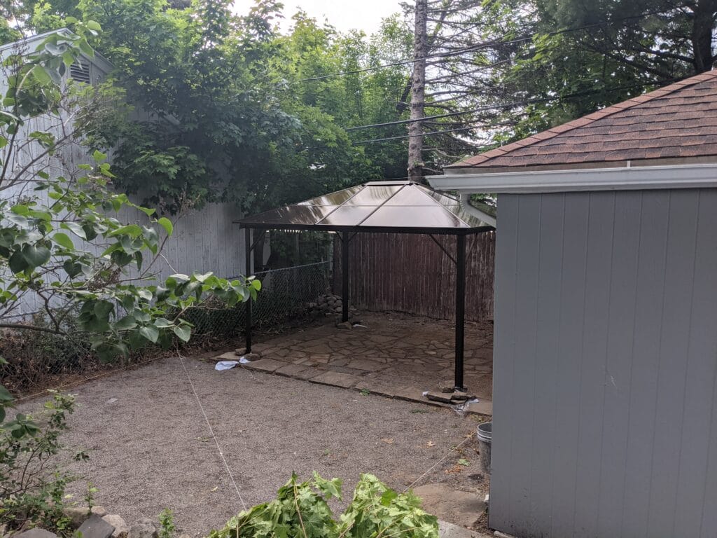 Filled pond area leveled and tamped in Irondequoit, ready for paver installation.