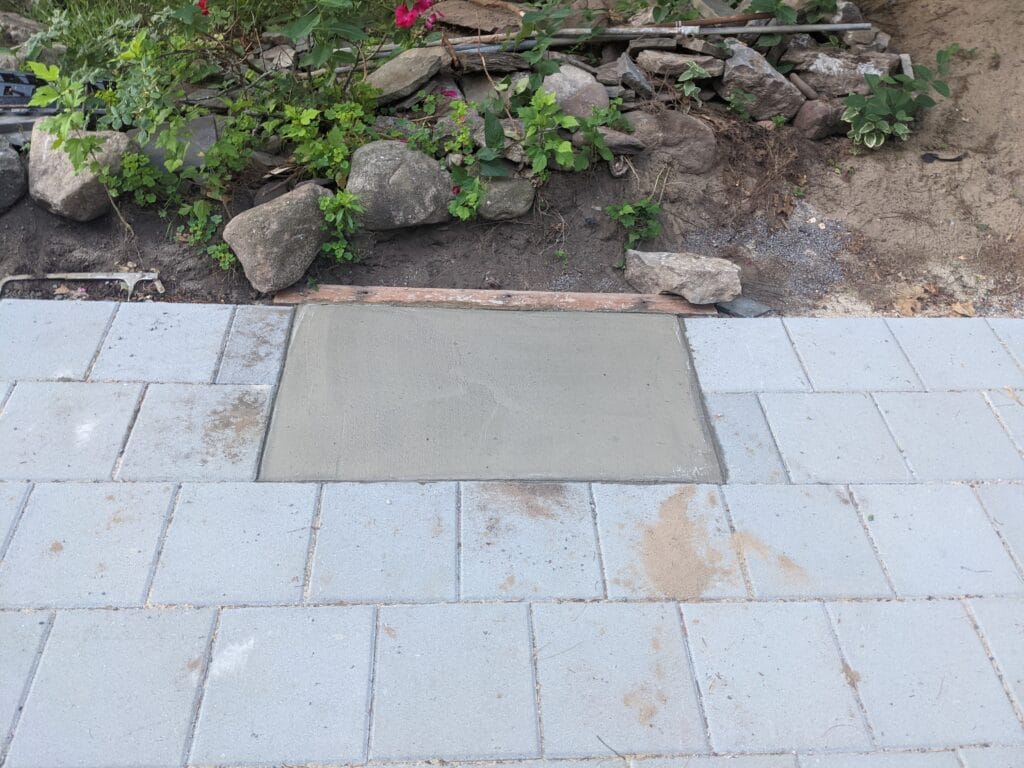 Concrete base poured for stone fireplace on patio in Irondequoit NY