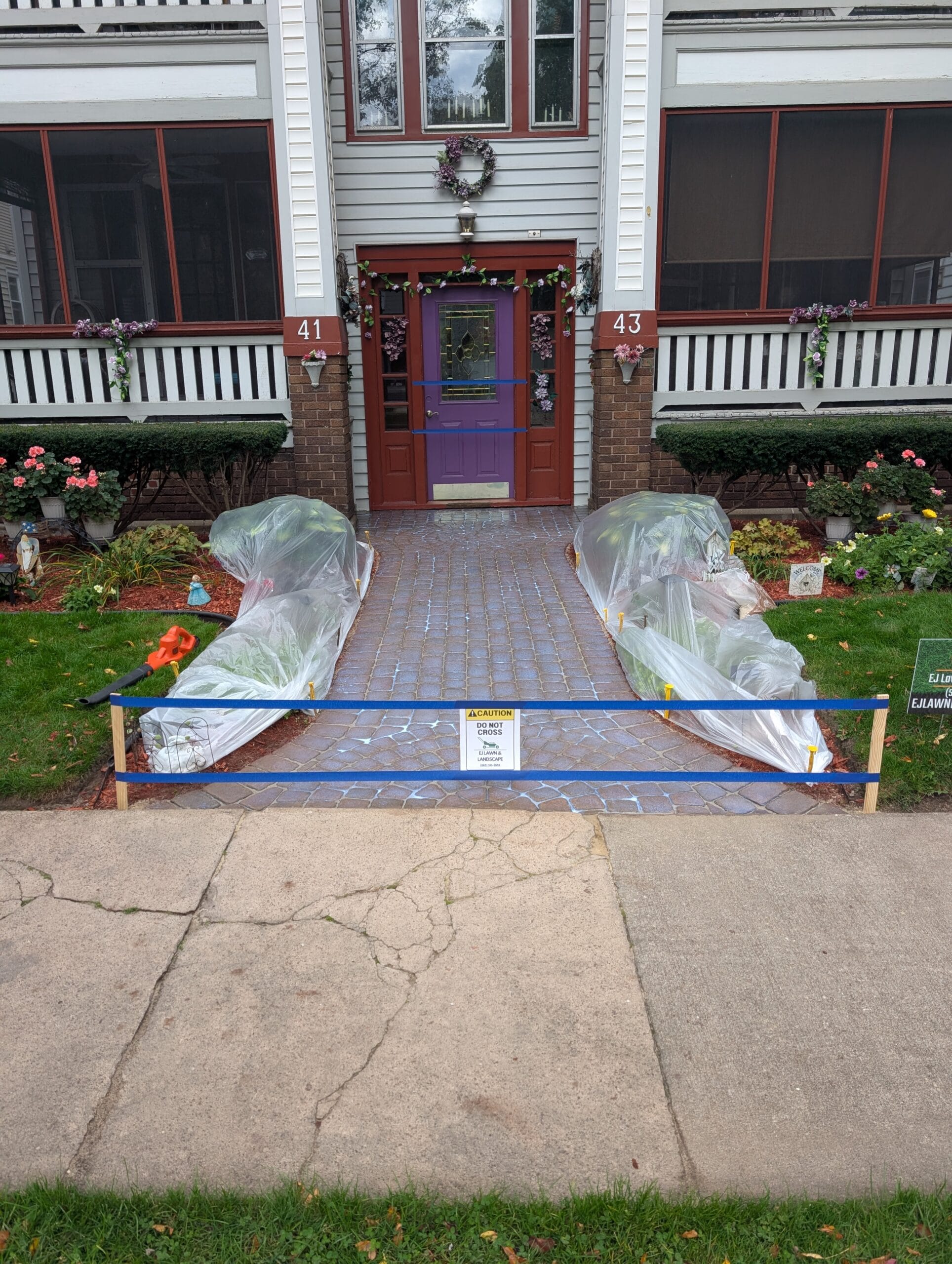 Front paver walkway after power washing and sealer applied in Rochester NY