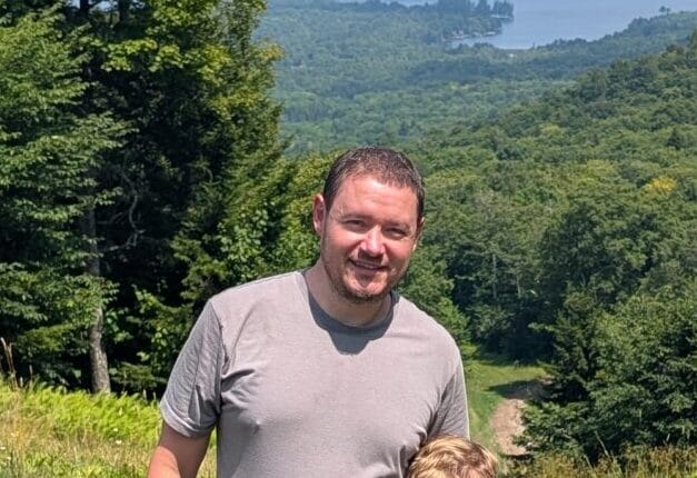 Geoff, project manager at EJ Lawn & Landscape, supervising landscaping work in Rochester, NY